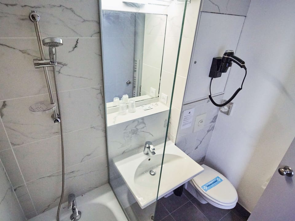 Bathtub, eco-friendly toiletries, hair dryer, towels