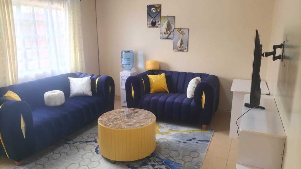 Comfort Apartment, City View | Living area | 24-inch Smart TV with digital channels