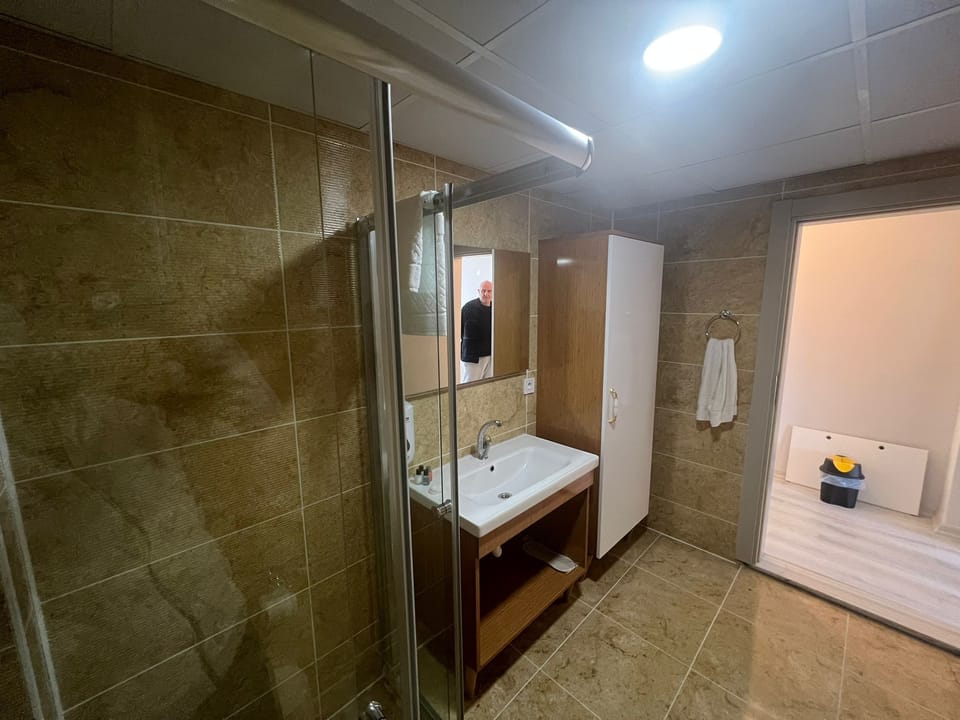 Deluxe Studio Suite, Sea View | Bathroom | Shower, hair dryer, towels, soap