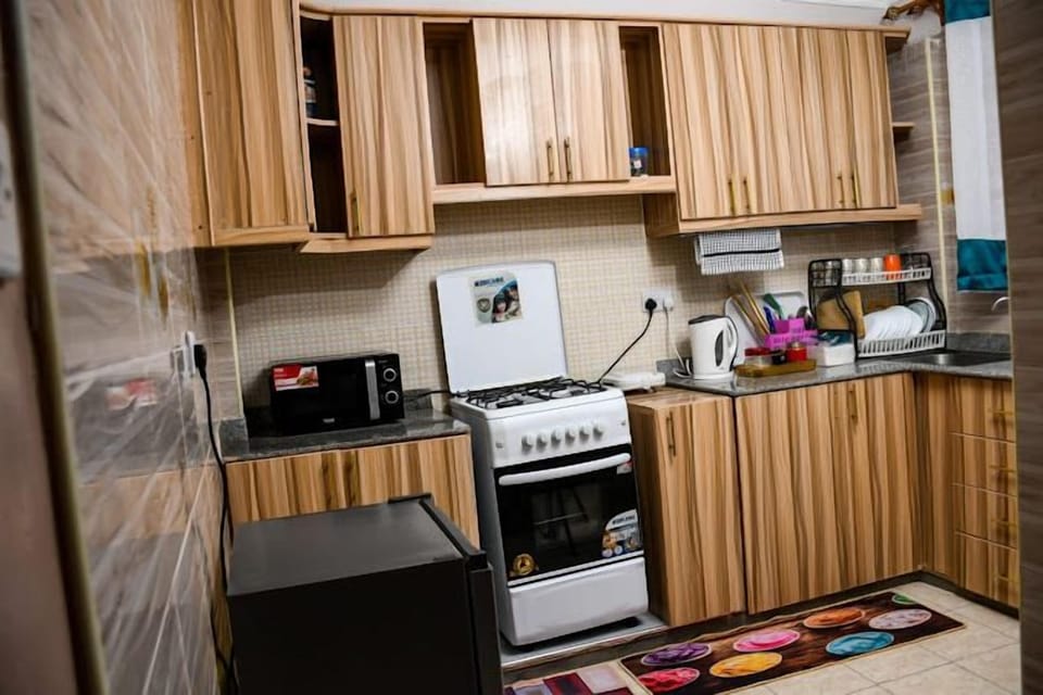 Deluxe Apartment, City View | Private kitchen | Fridge, microwave