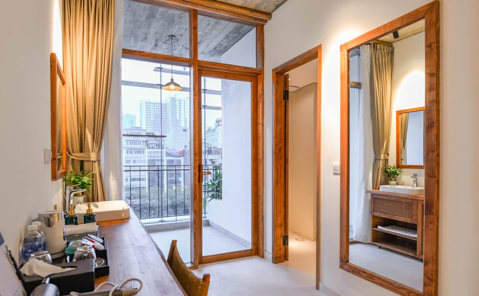 Deluxe Double Room, Balcony, City View | Minibar, in-room safe, individually furnished, desk