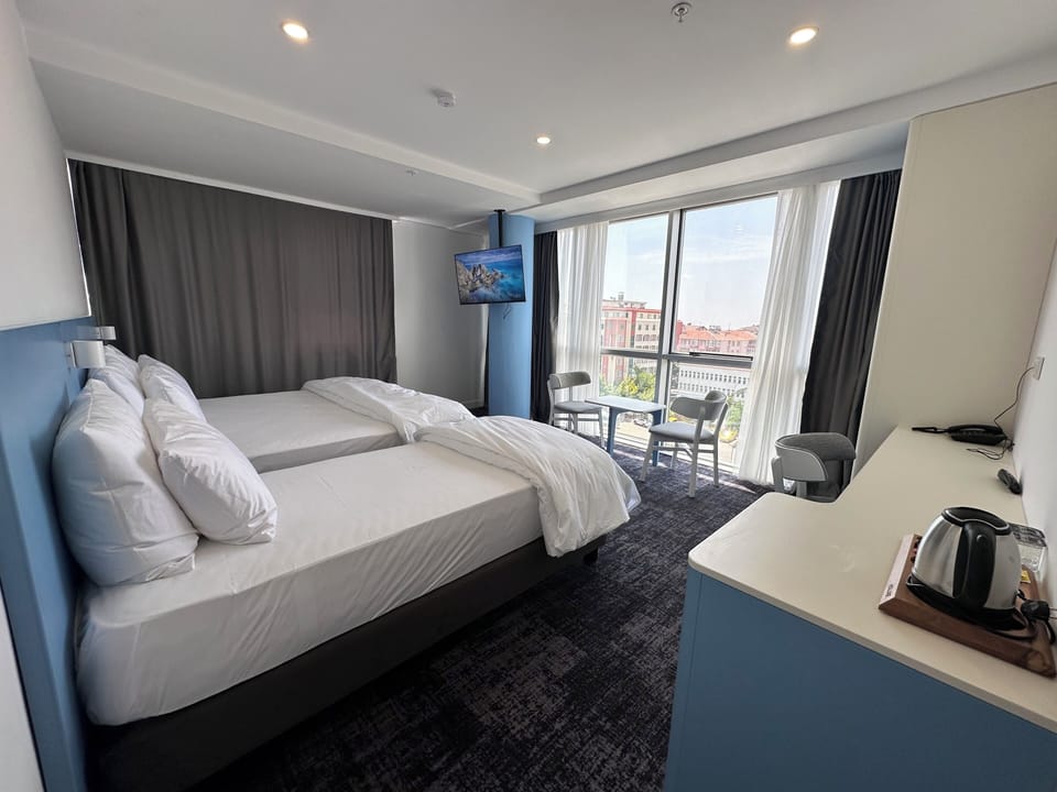 Family Triple Room, City View | Desk, laptop workspace, WiFi (free)
