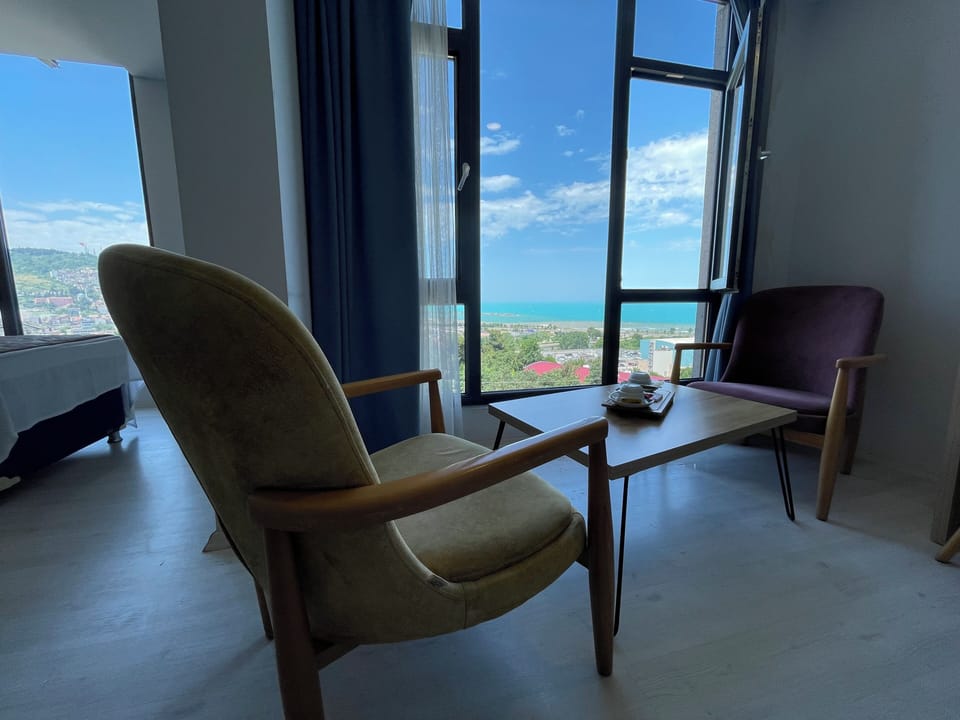 Triple Room, Sea View | Living area