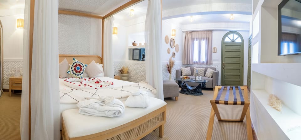 Luxury Suite, Courtyard View | Premium bedding, in-room safe, iron/ironing board, free WiFi