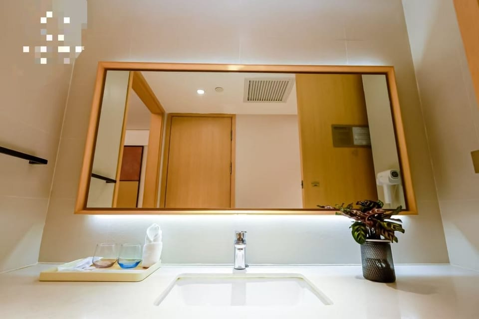 Shower, hair dryer, slippers, towels
