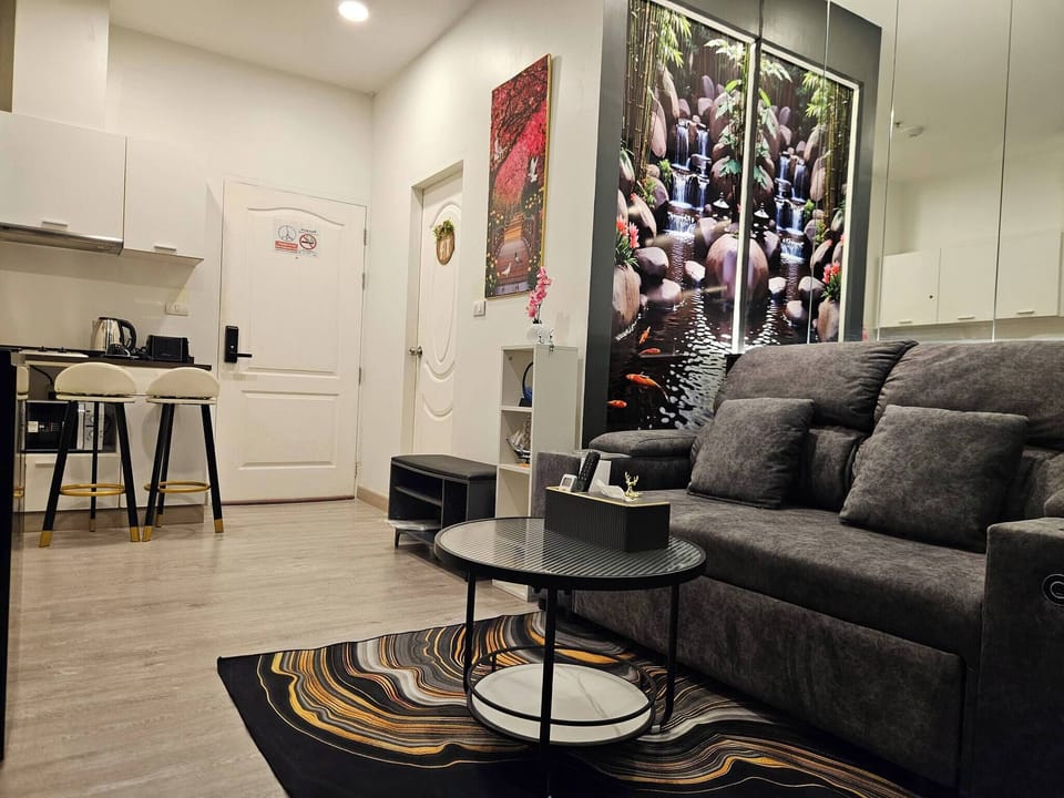 Condo, 1 Bedroom, Balcony | Living room | Flat-screen TV