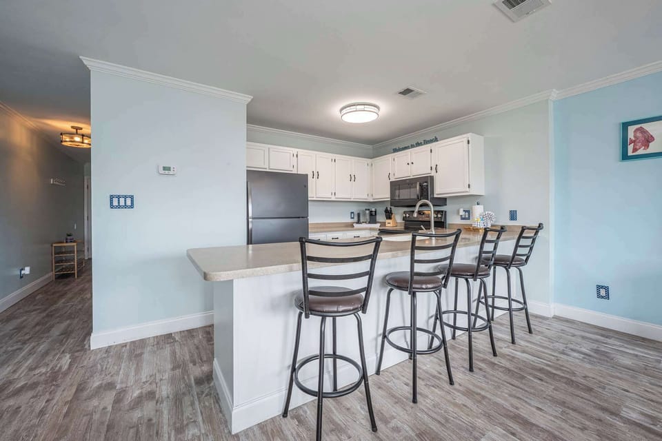 Condo, 1 Queen Bed with Sofa bed, Balcony, Garden View (Emerald Isle Escape) | Private kitchen | Fridge, microwave, oven, stovetop