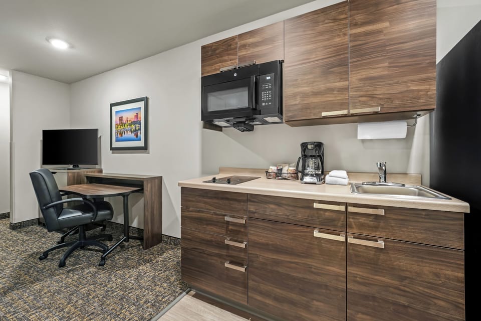 Full-size fridge, microwave, stovetop, coffee/tea maker