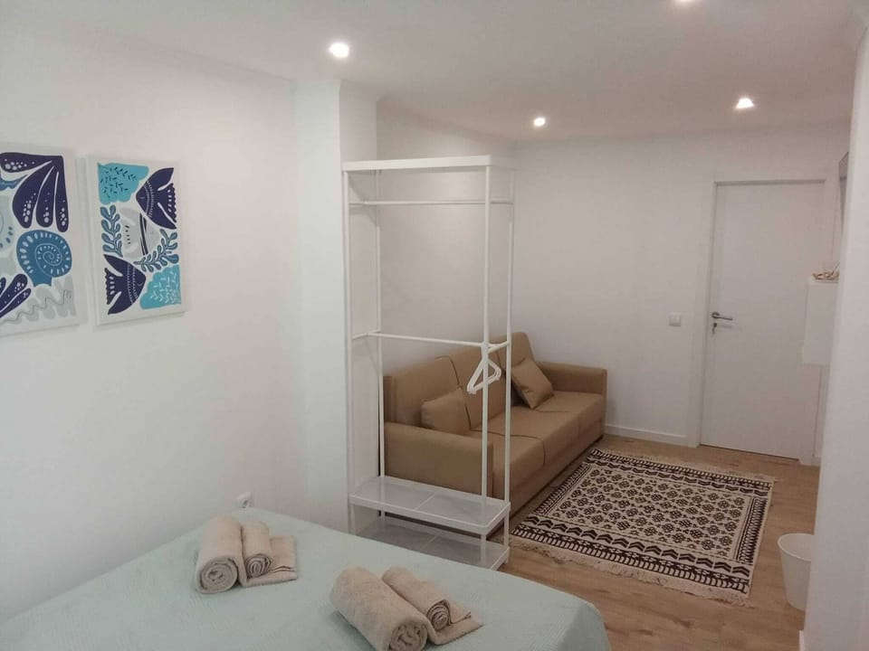 Triple Room, Courtyard View | Blackout drapes, iron/ironing board, free WiFi