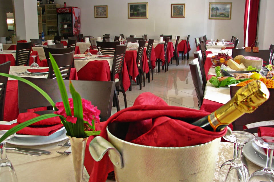 Breakfast, lunch, dinner served; Italian cuisine, garden views 