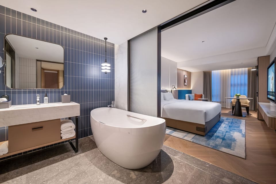 Superior Room, 1 King Bed | Bathroom | Rainfall showerhead, designer toiletries, hair dryer, bathrobes