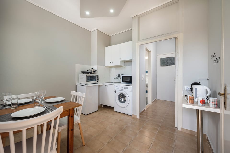 Classic Triple Room, Balcony, Garden View | Private kitchen | Full-size fridge, microwave, stovetop, espresso maker