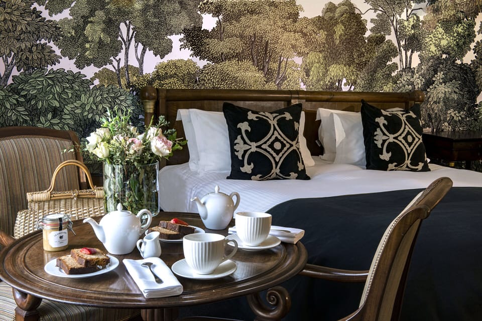 Suite | Minibar, in-room safe, individually decorated, blackout drapes