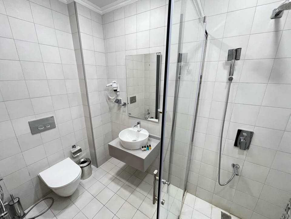 Shower, free toiletries, hair dryer, towels