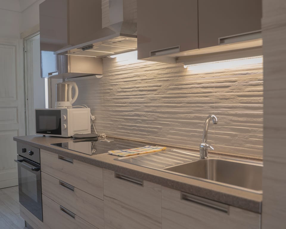 Comfort Apartment | Private kitchen | Fridge, stovetop, espresso maker, cookware/dishes/utensils