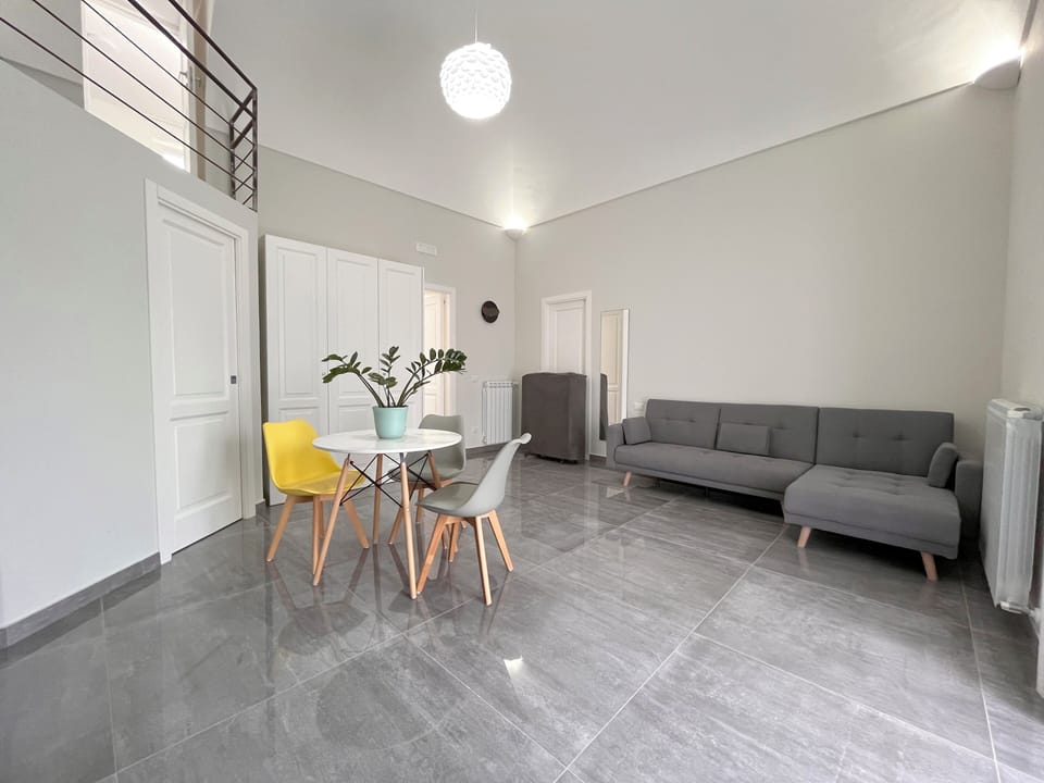 Deluxe Double Room, Balcony | Living area | TV