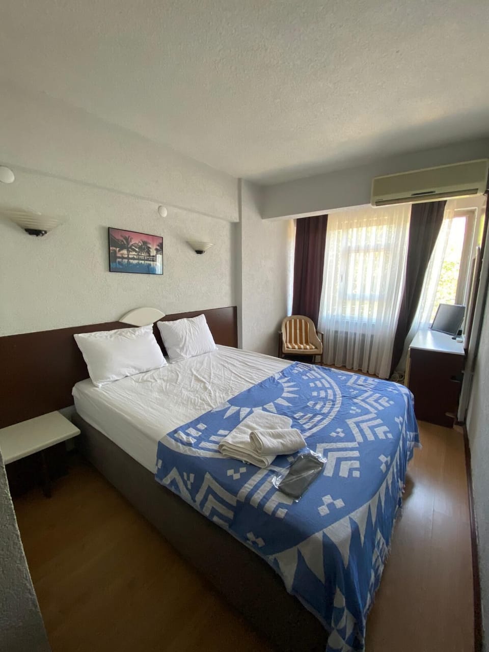 Desk, laptop workspace, bed sheets