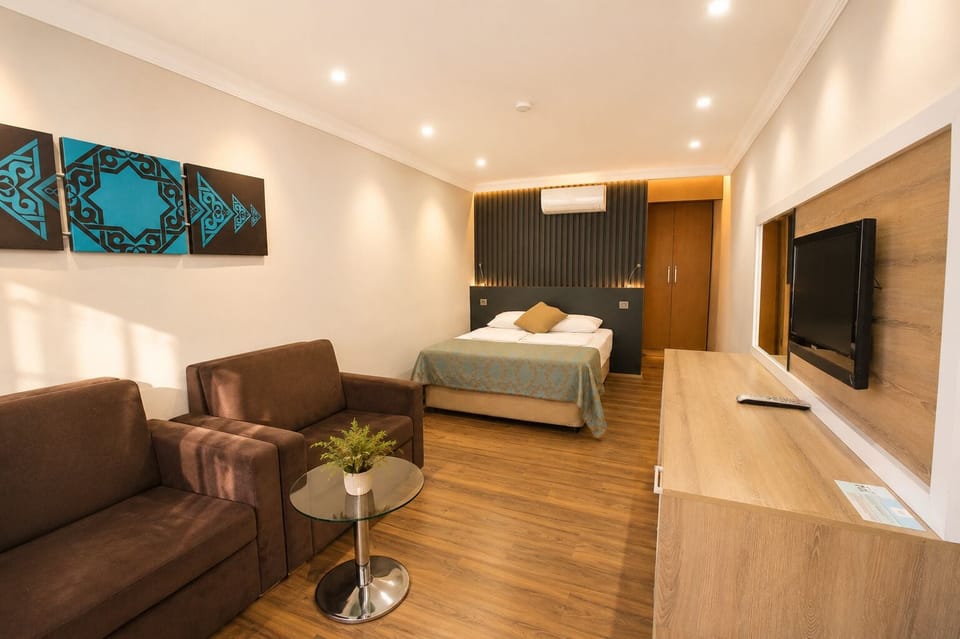 Family Studio Suite, Patio | Desk, laptop workspace, free WiFi