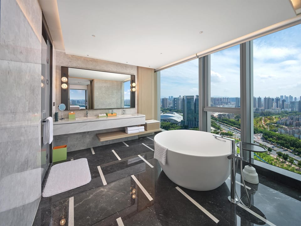 Premium Suite, 1 King Bed | Bathroom | Hair dryer, towels, shampoo, toilet paper