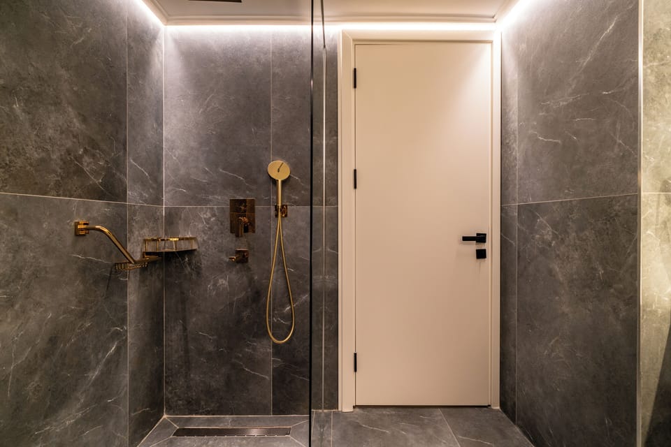 Shower, hair dryer, slippers, towels