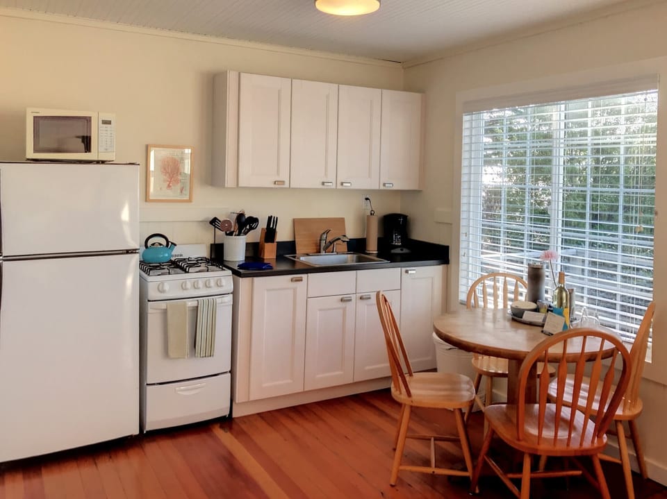 Fuchsia Cottage | Private kitchen | Coffee/tea maker, microwave, highchair