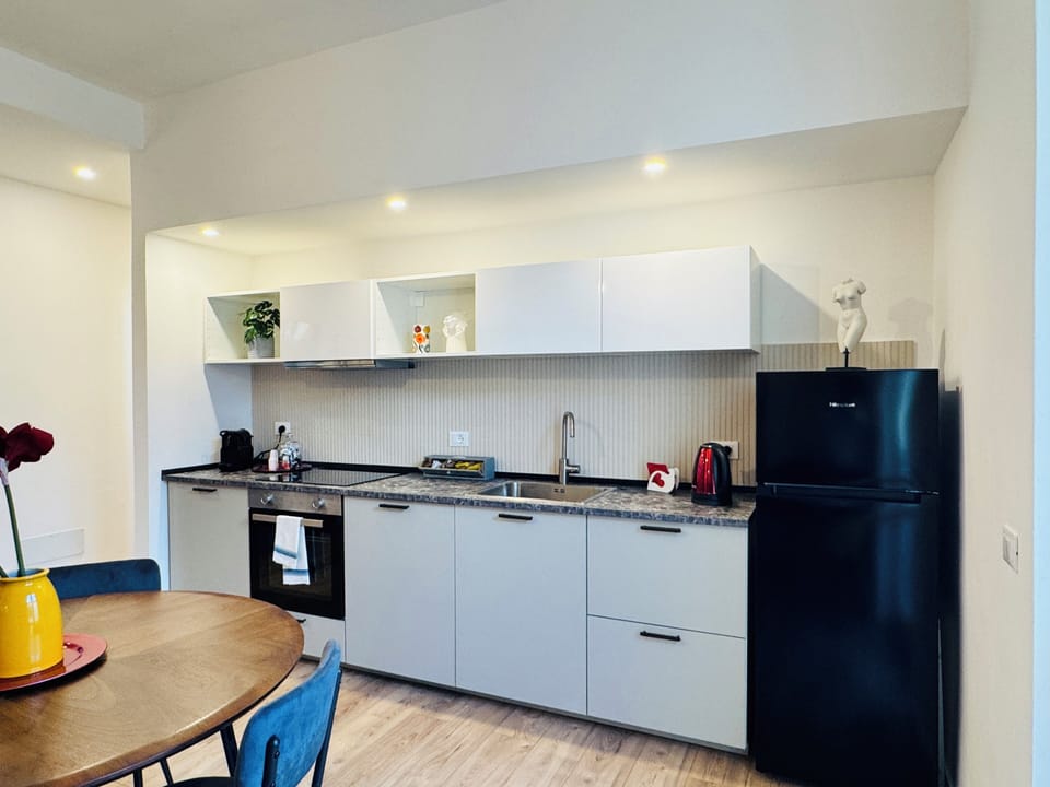 Design Apartment, 2 Bedrooms, Balcony, Courtyard View | Living area | Flat-screen TV