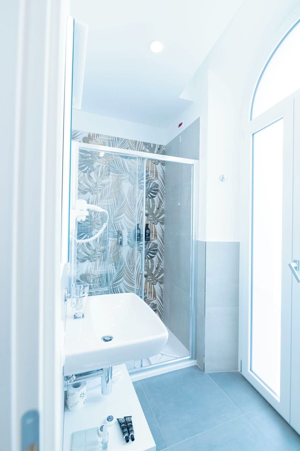 Family Quadruple Room | Bathroom | Shower, hair dryer, slippers, towels
