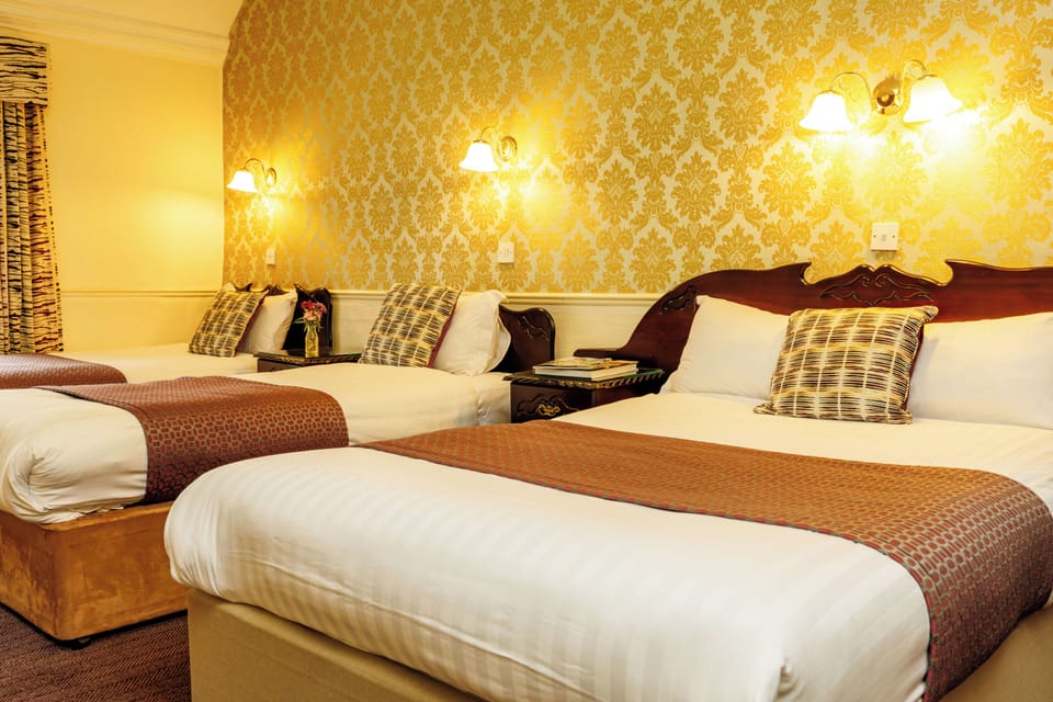 Family Room, Multiple Beds, City View | Premium bedding, desk, laptop workspace, blackout drapes