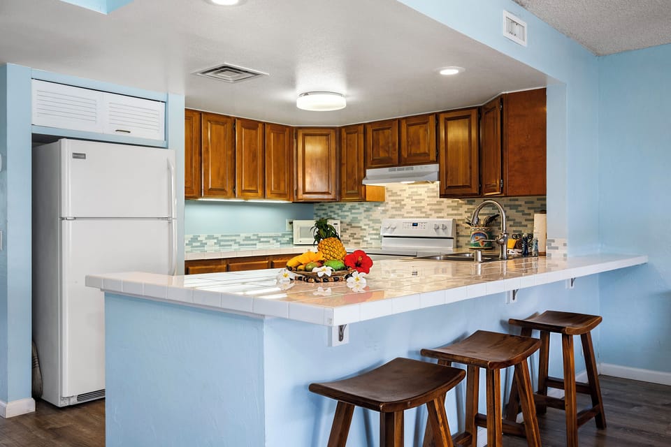 Condo, Multiple Beds, Lanai, Partial Ocean View (White Sands Village 210) | Private kitchen | Full-size fridge, microwave, oven, stovetop