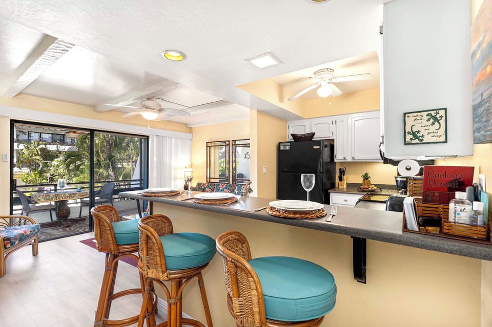 Condo, 1 Queen Bed with Sofa bed, Lanai, Partial Ocean View (Casa de Emdeko 212) | Private kitchen | Dining tables