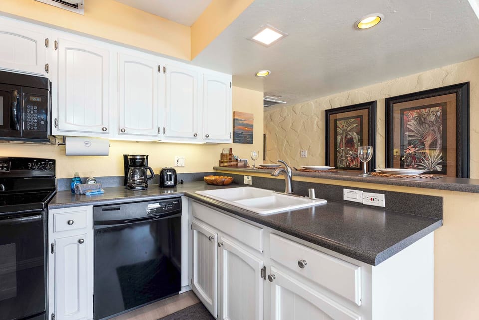Condo, 1 Queen Bed with Sofa bed, Lanai, Partial Ocean View (Casa de Emdeko 212) | Private kitchen | Dining tables