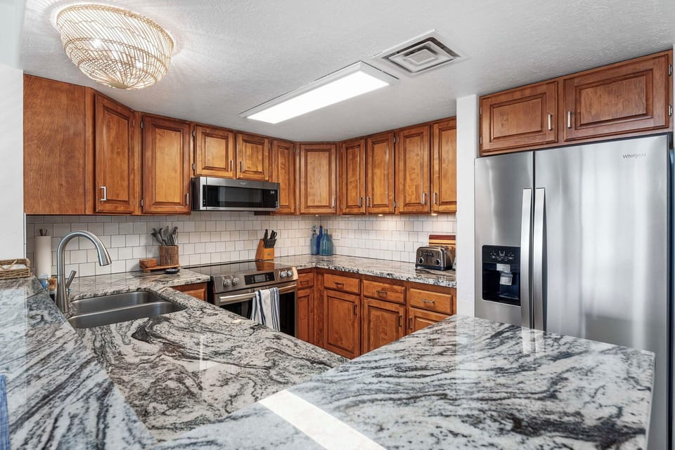 Condo, Multiple Beds, Lanai, Garden View (White Sands Village 127) | Private kitchen | Dining table