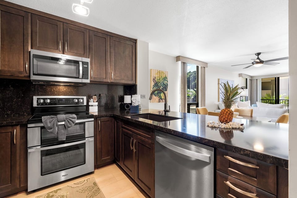 Condo, Multiple Beds, Kitchen, Partial Ocean View (Kona by the Sea 115) | Private kitchen | Dining tables