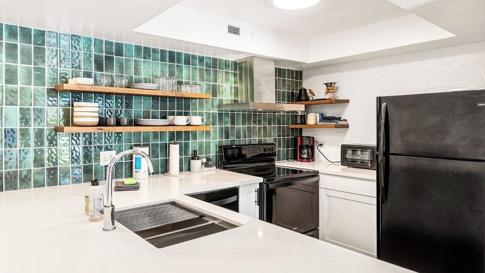 Condo, 1 King Bed, Lanai, Garden View (Casa de Emdeko 124) | Private kitchen | Dining tables
