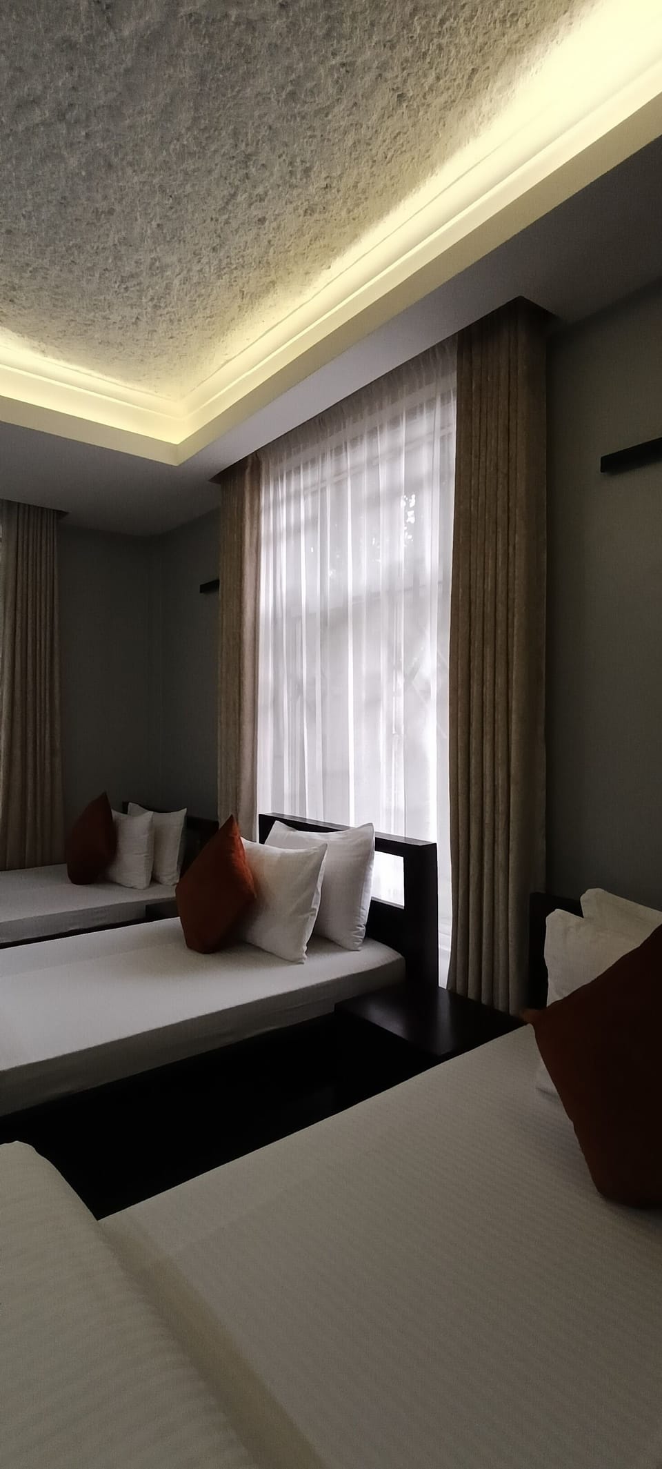 Premium bedding, desk, laptop workspace, blackout drapes