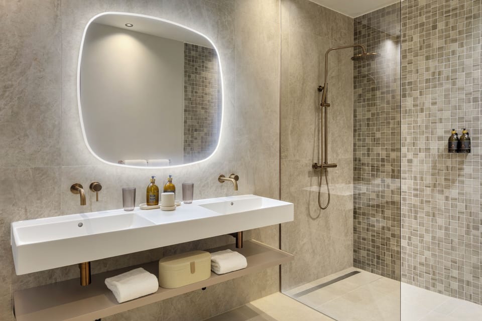 Designer toiletries, hair dryer, bathrobes, heated floors