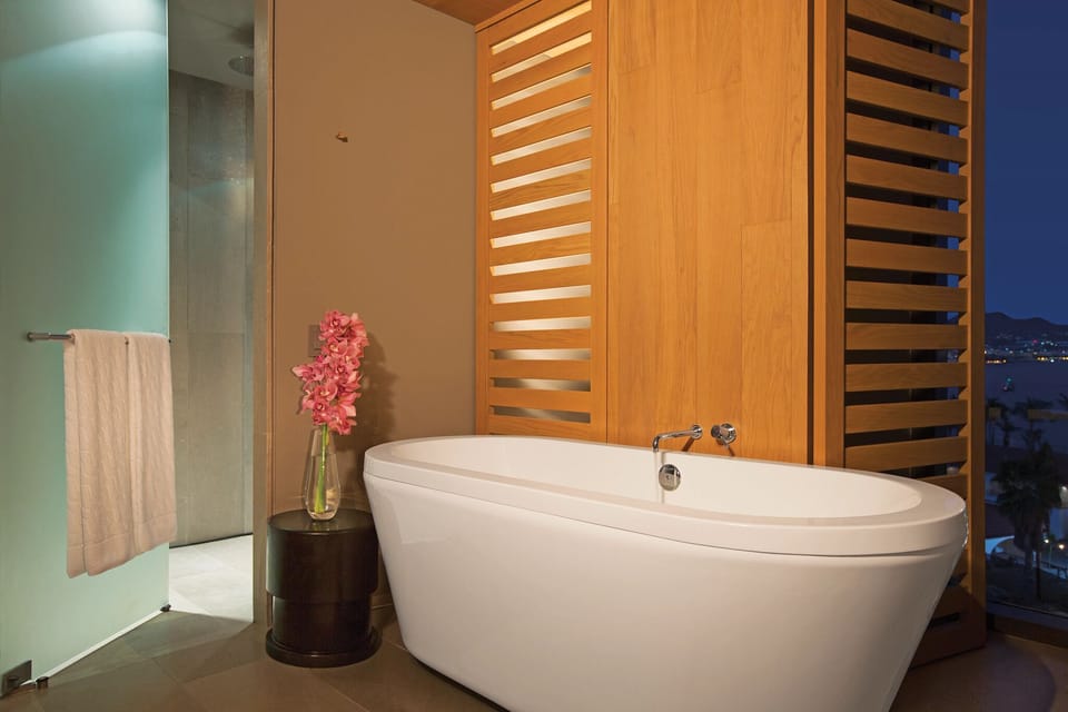 Xhale Club Master One Bedroom Suite | Bathroom | Shower, rainfall showerhead, designer toiletries, hair dryer