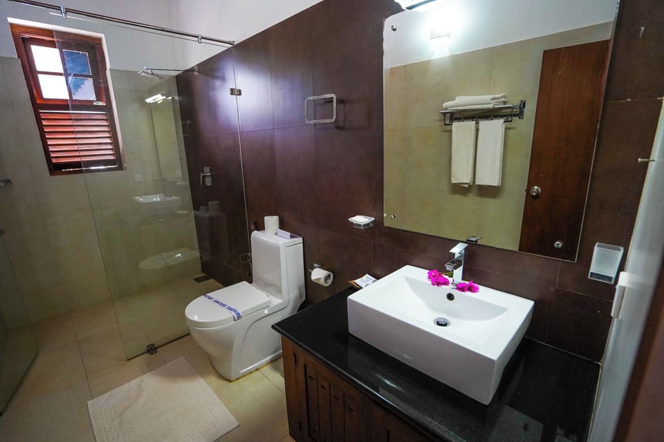 Shower, free toiletries, hair dryer, slippers