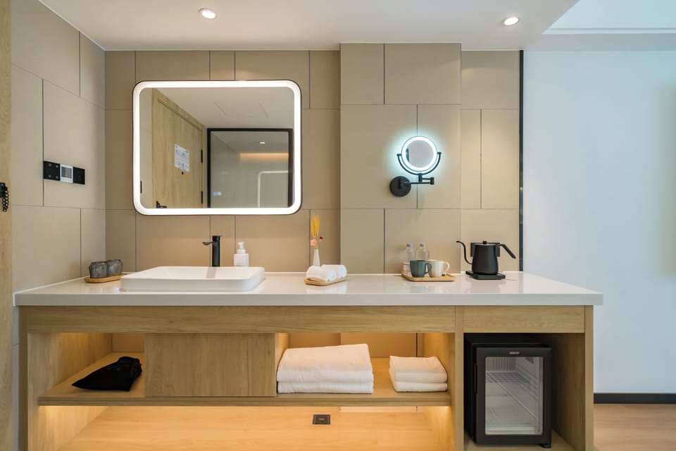 Superior Double Room, City View | Living area | 75-inch LED TV with cable channels, smart speakers