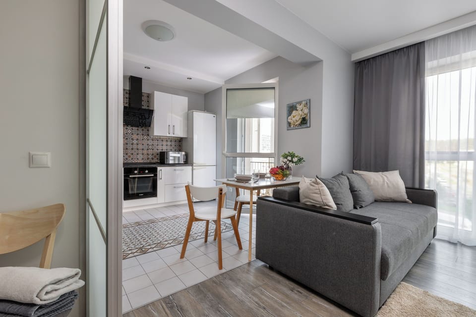 Classic Apartment, City View | Living area | 37-inch TV with cable channels