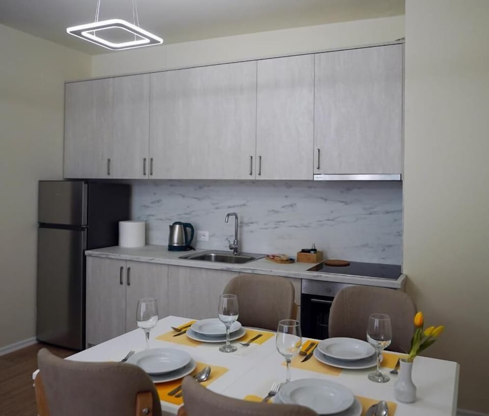 Family Apartment, City View | Living area | TV