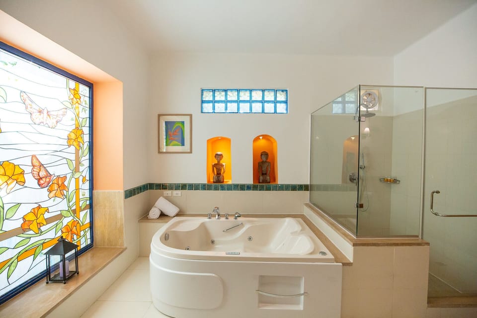 Panoramic Suite, 1 King Bed | Bathroom | Separate tub and shower, jetted tub, rainfall showerhead