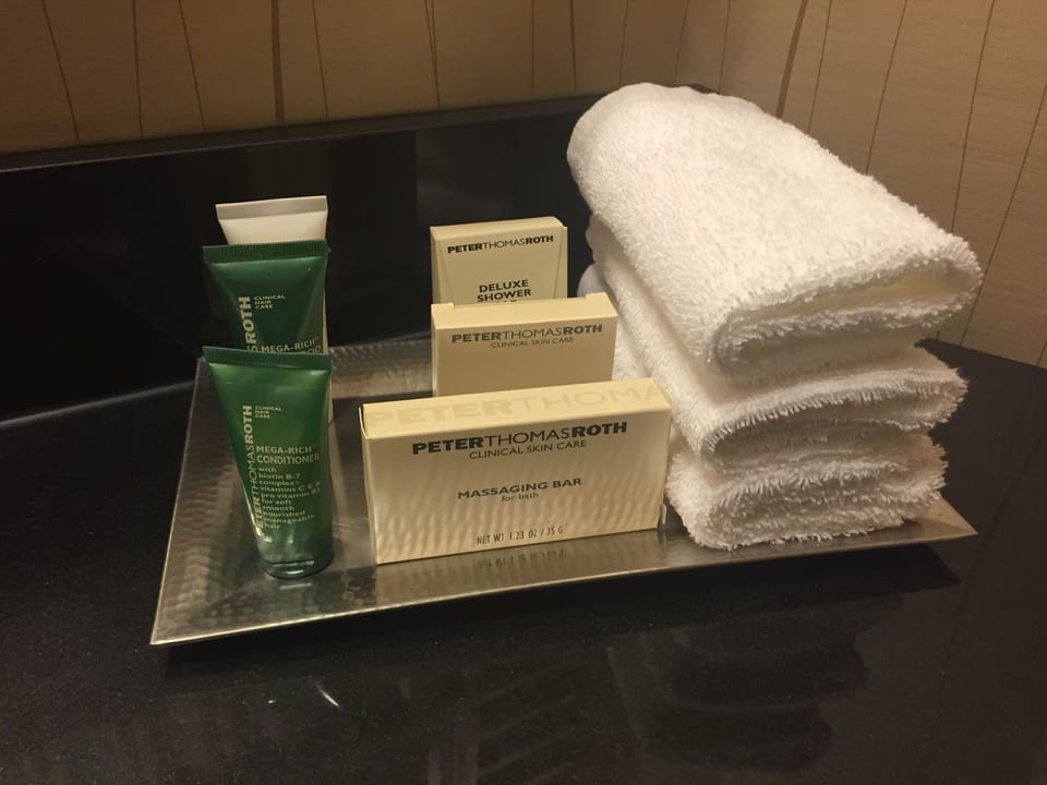Combined shower/tub, designer toiletries, hair dryer, bathrobes