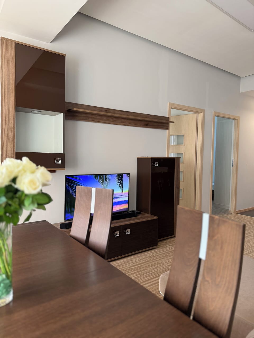 Deluxe Apartment, 2 Bedrooms, Balcony, Courtyard View | Living area | 50-inch Smart TV with cable channels, DVD player