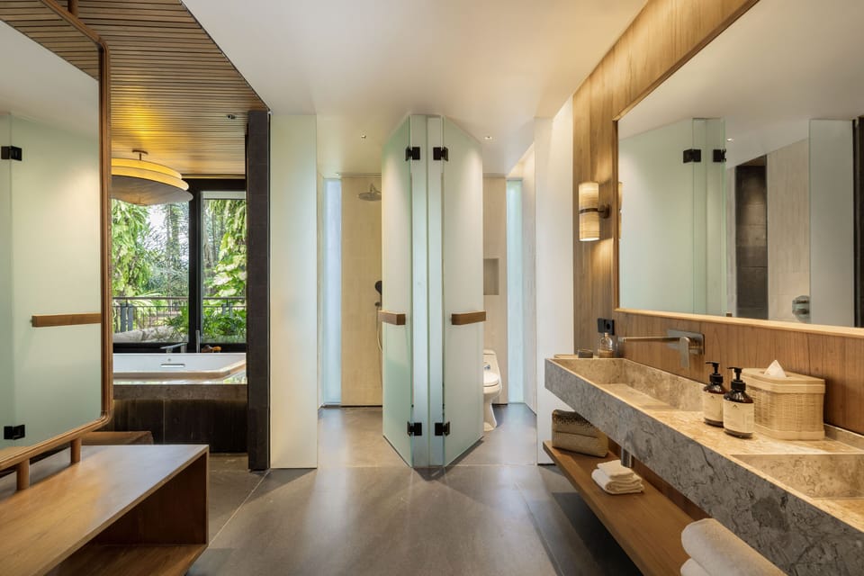 Suite | Bathroom | Separate tub and shower, rainfall showerhead, free toiletries