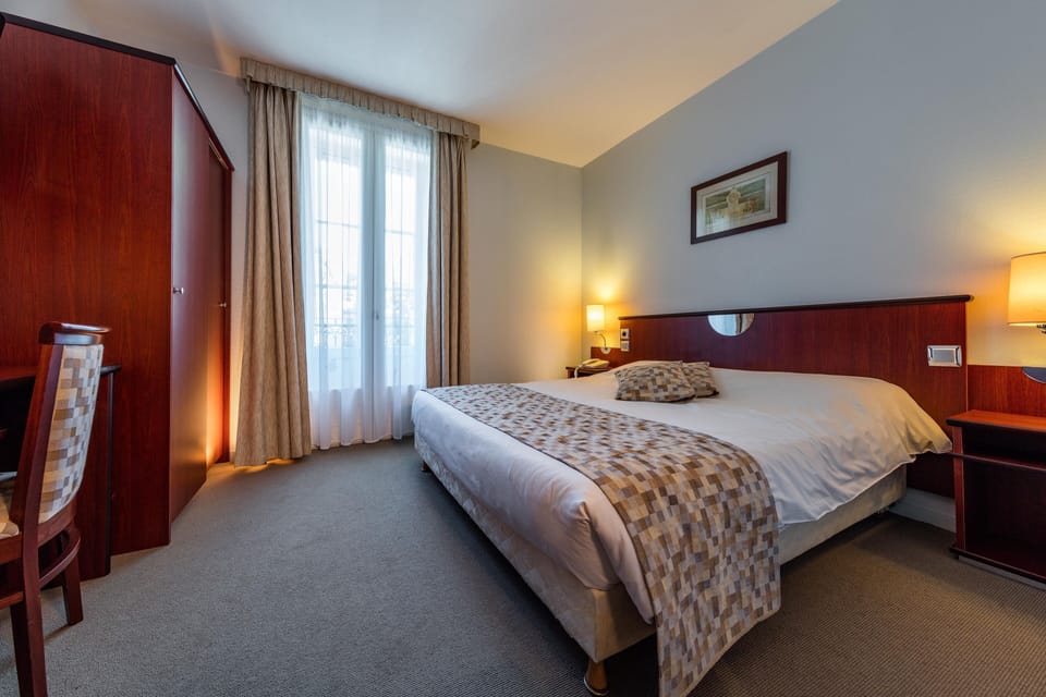 Family Room | Premium bedding, desk, blackout drapes, iron/ironing board