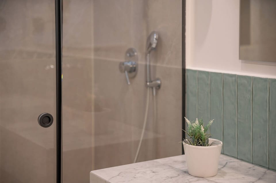 Junior Suite, Terrace, Garden View | Bathroom | Shower, rainfall showerhead, free toiletries, hair dryer