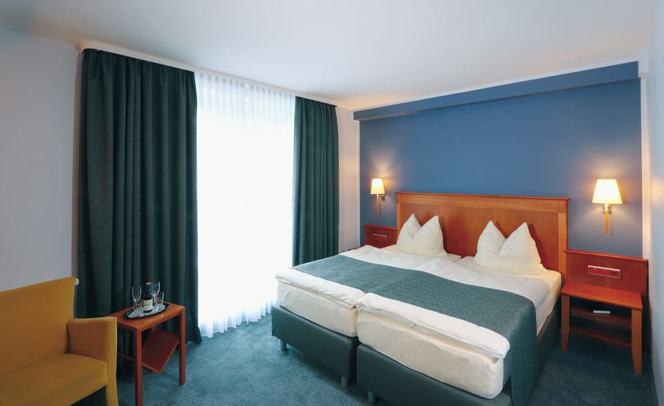 Hypo-allergenic bedding, minibar, in-room safe, desk