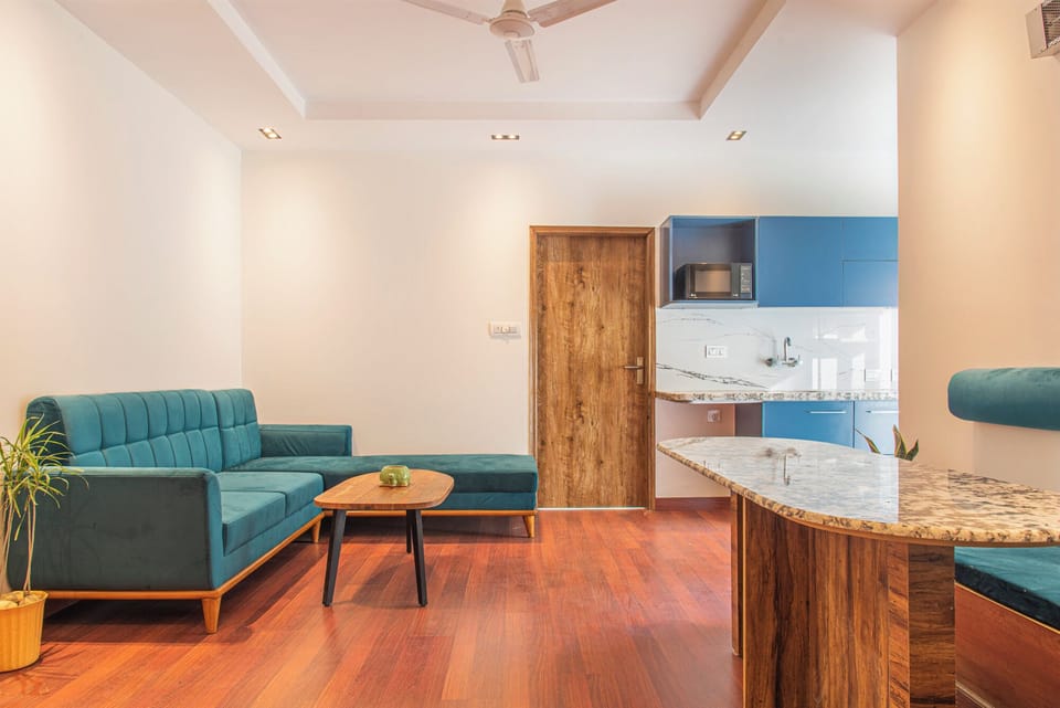 Family Suite | Living area | 42-inch Smart TV with satellite channels