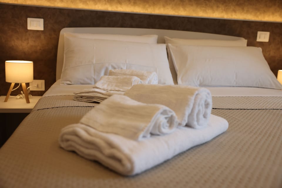 Deluxe Triple Room, Sea View | Desk, laptop workspace, soundproofing, free WiFi